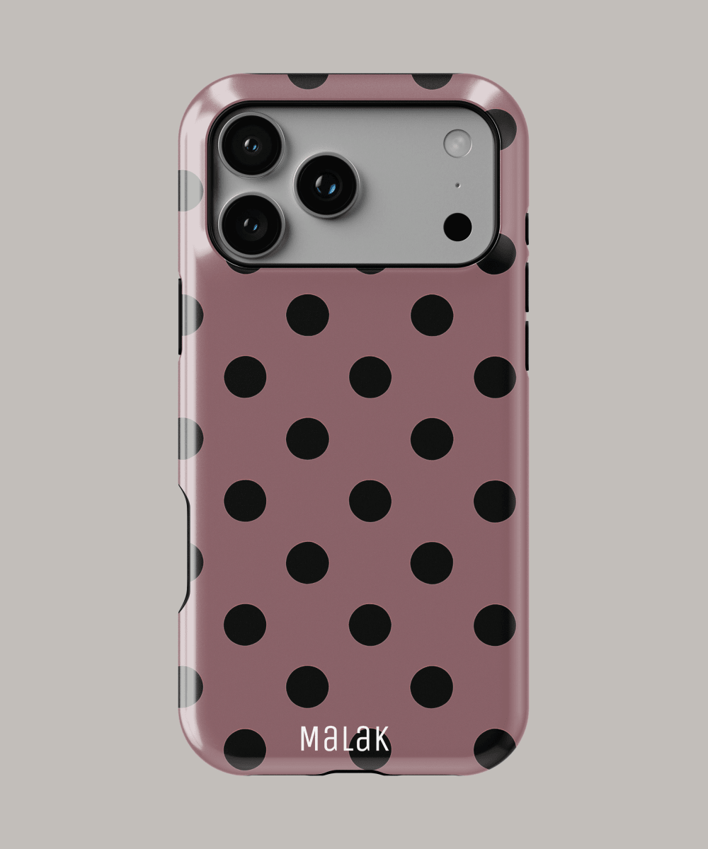 Funda personalizada para iPhone con diseño de lunares en color rosa y negro, resistente y estilizada.