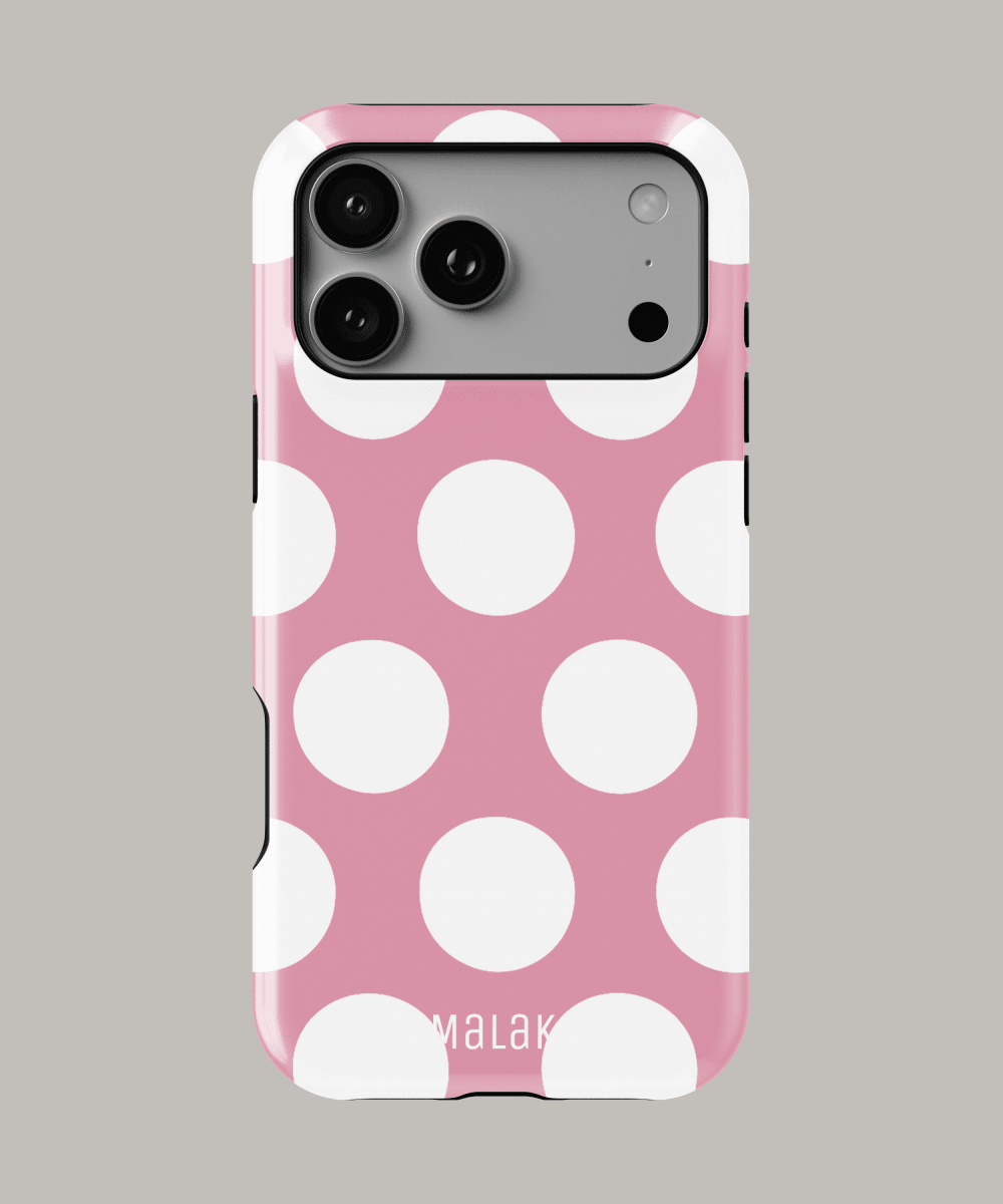 Funda personalizada iPhone lunares en diseño de lunares blancos sobre fondo rosa.