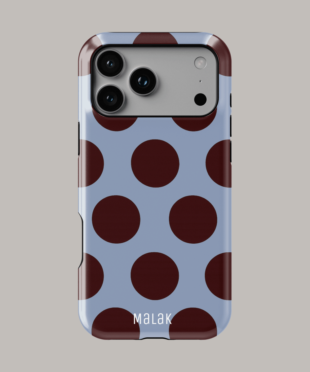 Funda de iPhone con diseño de lunares en color azul y marrón para máxima protección y estilo.