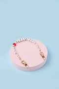 Straps personalizados para celulares Love You, elaborado a mano con perlas y broches de acero por artesanas colombianas.