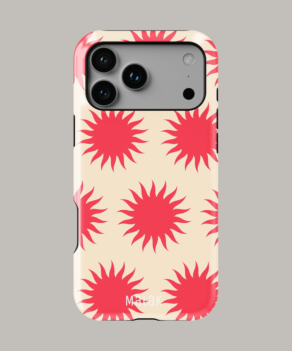 Funda personalizada para iPhone con diseño de soles rojos sobre fondo claro, ideal para máxima protección y estilo.