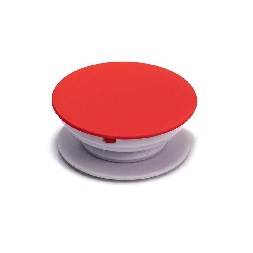 Socket soporte para celular Malak con sistema adhesivo, diseño en rojo y blanco para adaptar a case.